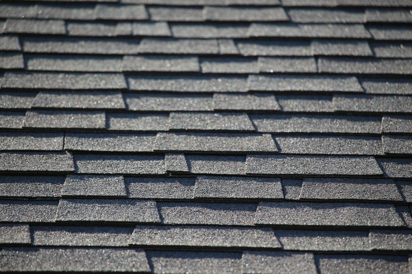 A close up of gray asphalt shingle texture